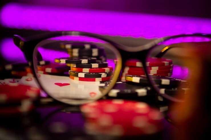 Live casino table with roulette, baccarat, and blackjack dealers